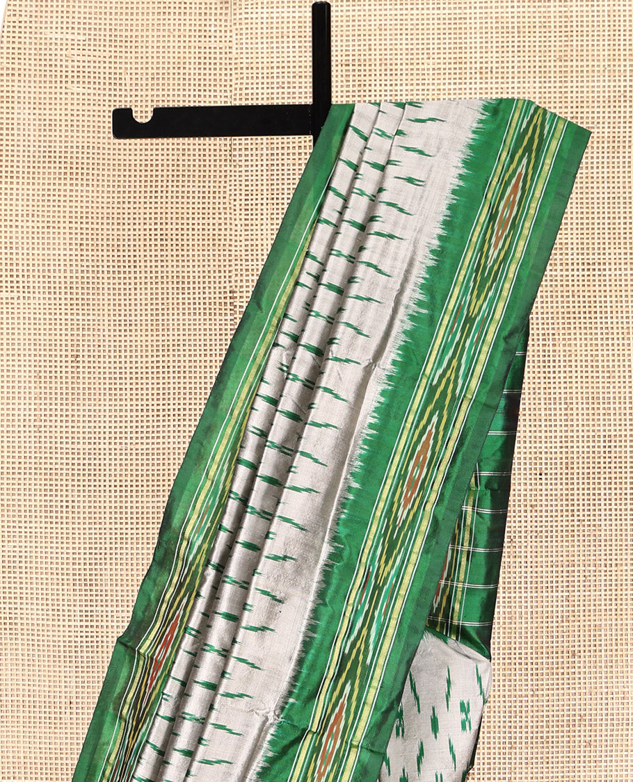 Grey-Green Pochampally Ikat Silk Saree, Adorned with Ikat Buttas, Complemented by a Contrast Ikat Border, Ikat-Style Pallu, and No Blouse