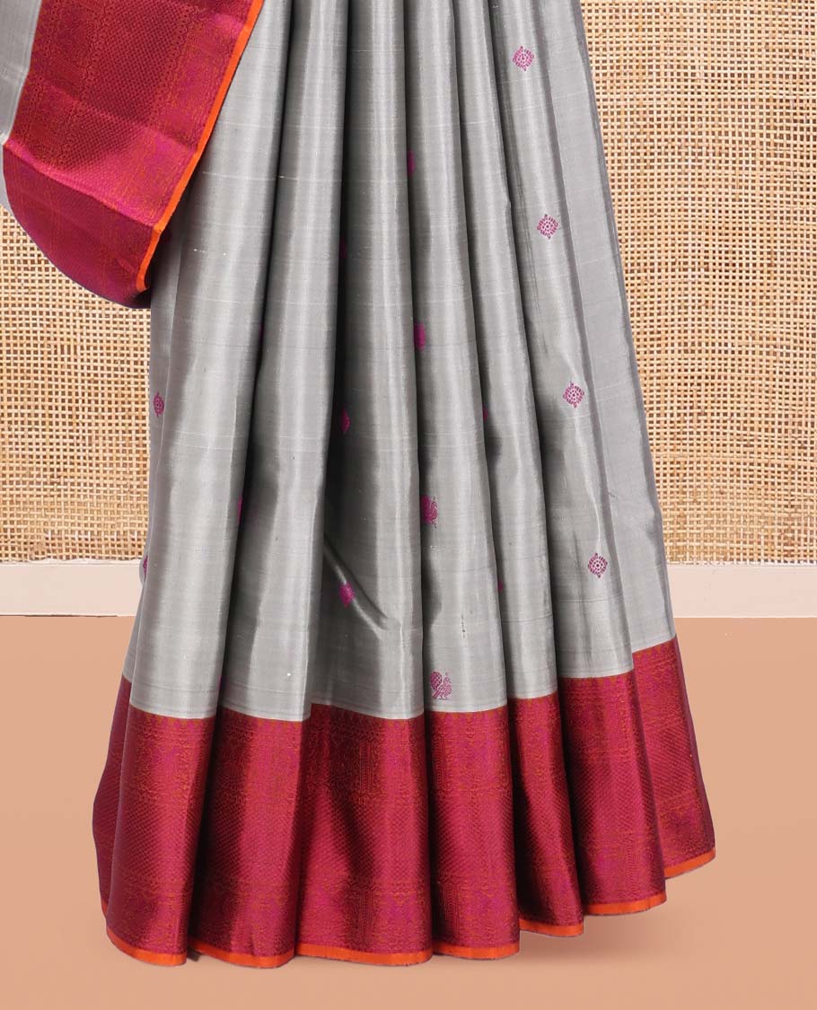 Grey Kanchipuram Silk Saree, Subtly Sparkled with Mayil-Chakram Buttas, a Contrast Border of Thilakam Mokku, Iruthalai Pakshi, and Kuyil Kann, Jaal Pallu, and a Contrast Blouse
