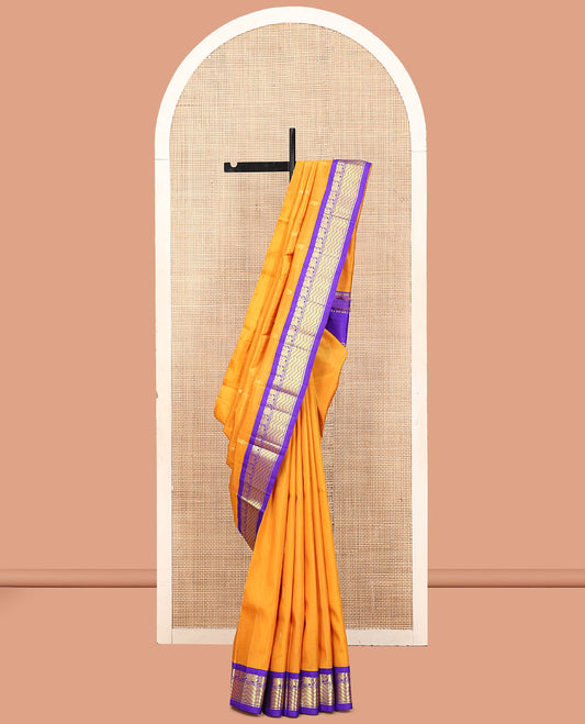 Yellow Kanchipuram Silk Saree, Subtly Sparkled with Zari Buttas, a Contrast One-Sided Korvai Border of Mayil Designs, a Floral Design Pallu, and No Blouse