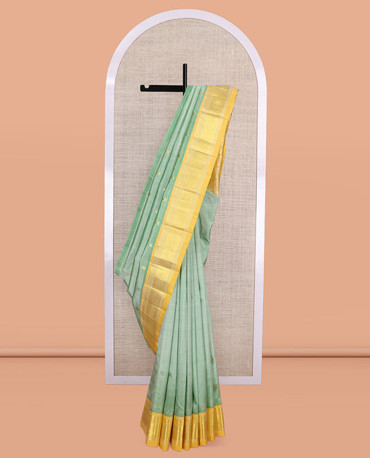 Green Kanchipuram Silk Saree, Woven with Zari Buttas, a Contrast One-Sided Border of Panner Sombu, Banaras, and Jaal Designs, Floral Creeper Pallu, and No Blouse
