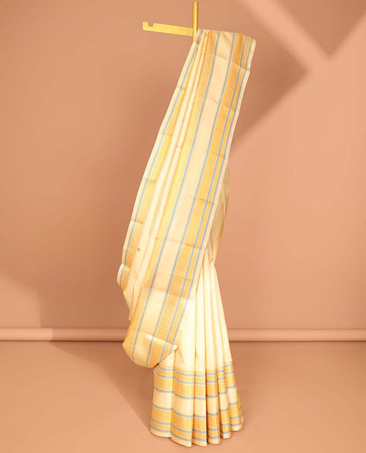 Cream floral buttas kancheepuram silk saree with self border of intricat zari design & peacock, floral design pallu