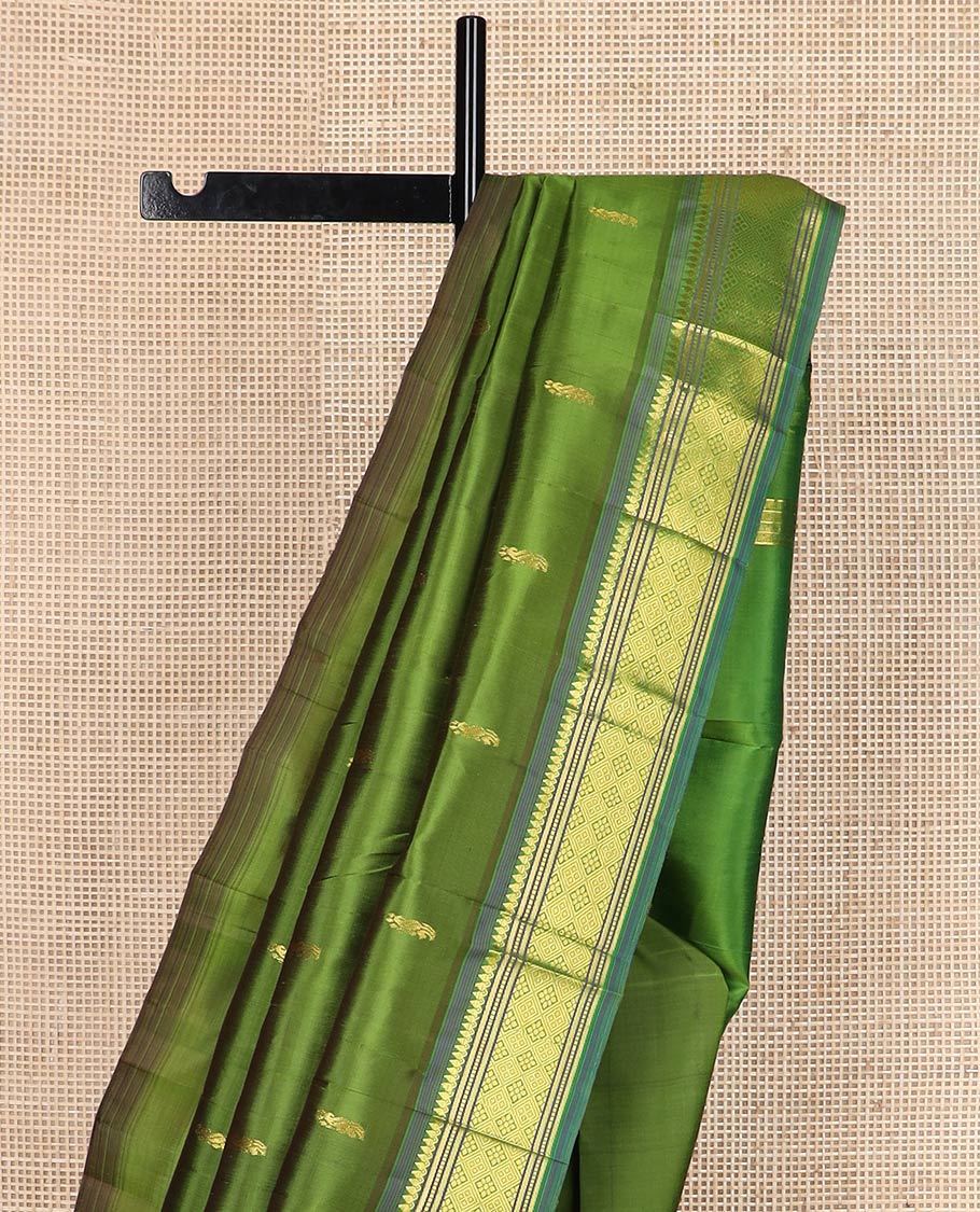 Green zari buttas silk saree, contrast one-sided border of thilakam mokku, banaras, muthu & jaal designs & zari design pallu
