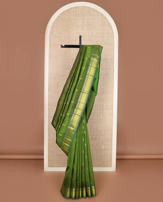 Green zari buttas silk saree, contrast one-sided border of thilakam mokku, banaras, muthu & jaal designs & zari design pallu
