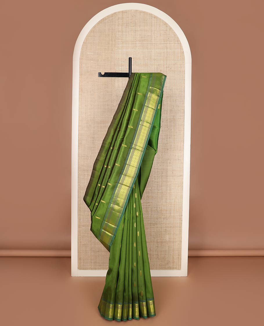 Green zari buttas silk saree, contrast one-sided border of thilakam mokku, banaras, muthu & jaal designs & zari design pallu