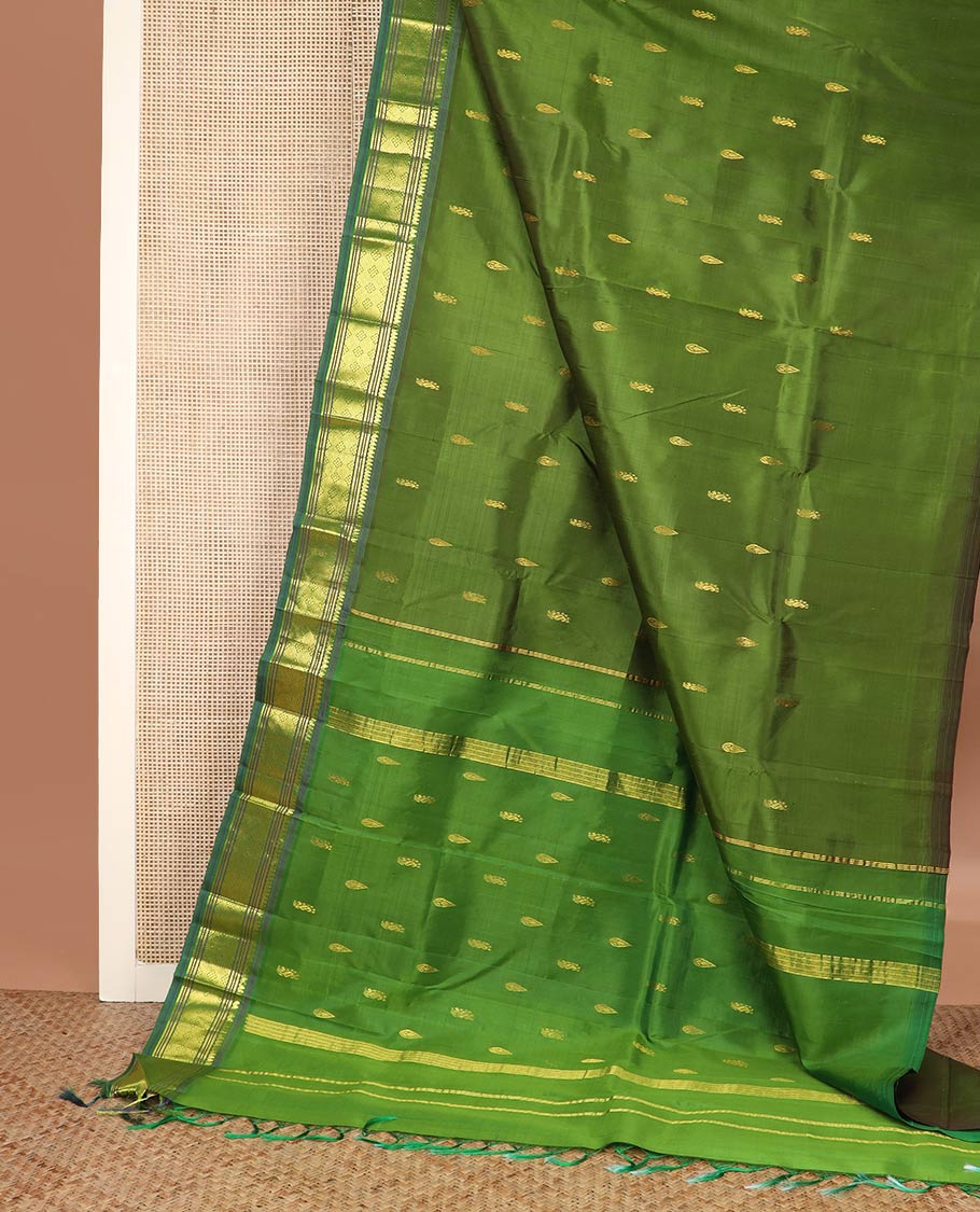 Green zari buttas silk saree, contrast one-sided border of thilakam mokku, banaras, muthu & jaal designs & zari design pallu