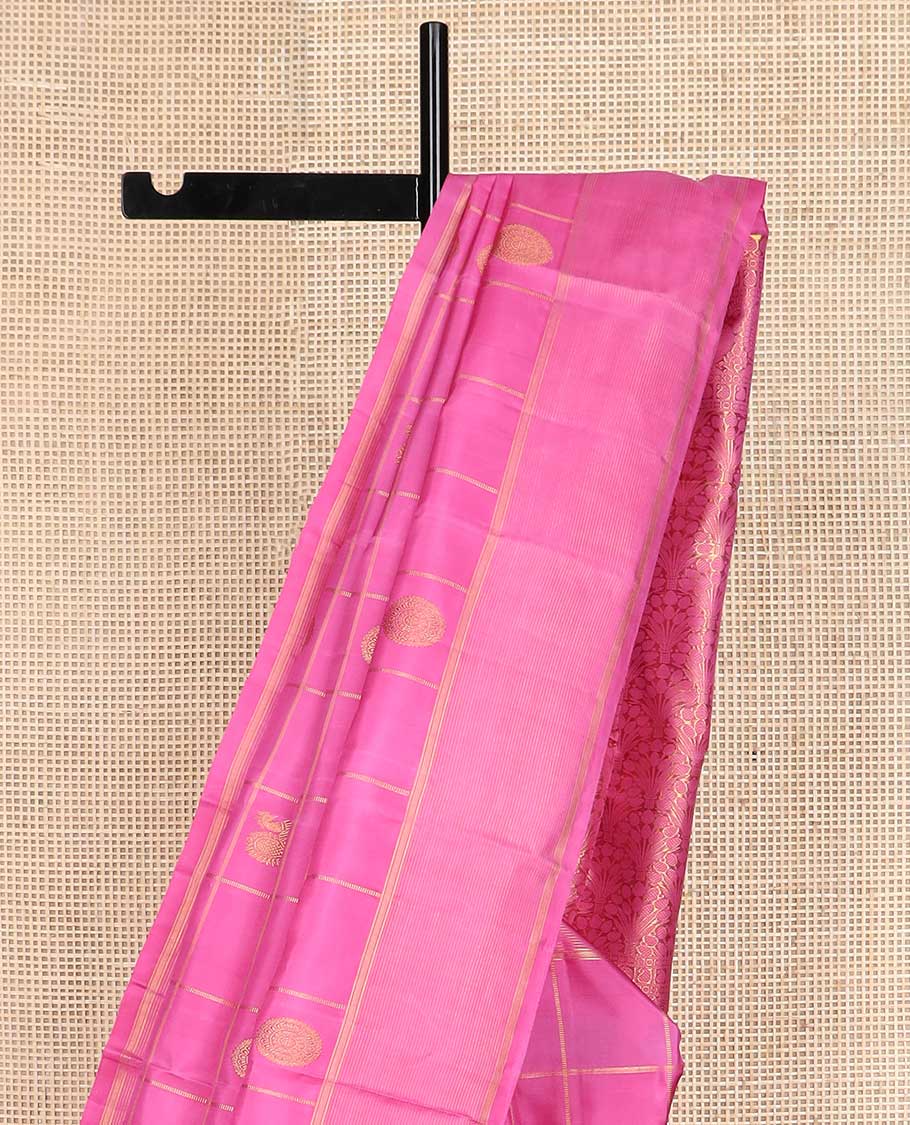 Pink annam chakram buttas enclosed checked Kanchipuram silk saree, zari border of stripes, and pallu of scallop designs