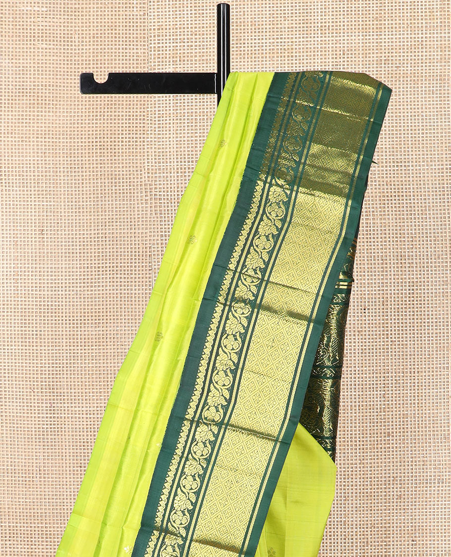 Green zari buttas Kanchipuram silk saree, contrast korvai border of thilakam mokku, kodi visiry, and jaal designs, and pallu of ancient human figurines