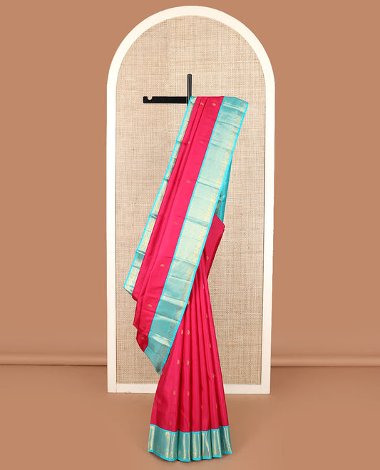 Red vanki manga buttas Kanchipuram silk saree, contrast korvai border of salngai, banaras, ara maadam, and anna chakram designs, and jaal pallu