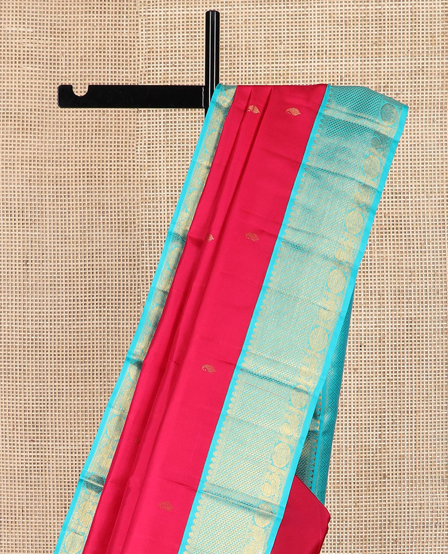 Red vanki manga buttas Kanchipuram silk saree, contrast korvai border of salngai, banaras, ara maadam, and anna chakram designs, and jaal pallu