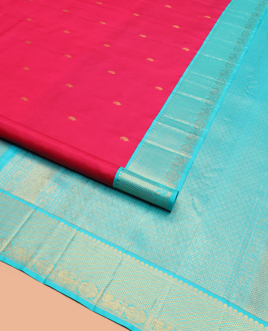 Red vanki manga buttas Kanchipuram silk saree, contrast korvai border of salngai, banaras, ara maadam, and anna chakram designs, and jaal pallu