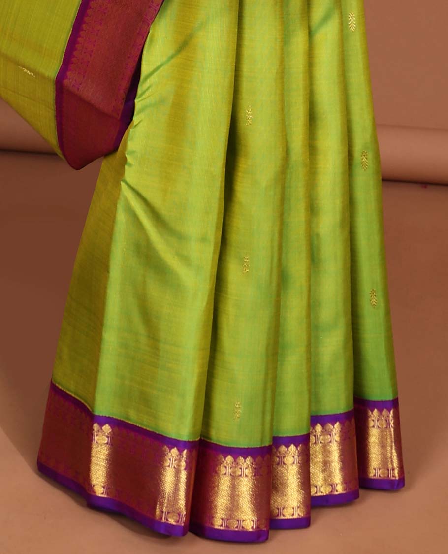Green leaf buttas kancheepuram silk saree with intricate zari pallu & korvai border of thilakam mokku,paun desigs