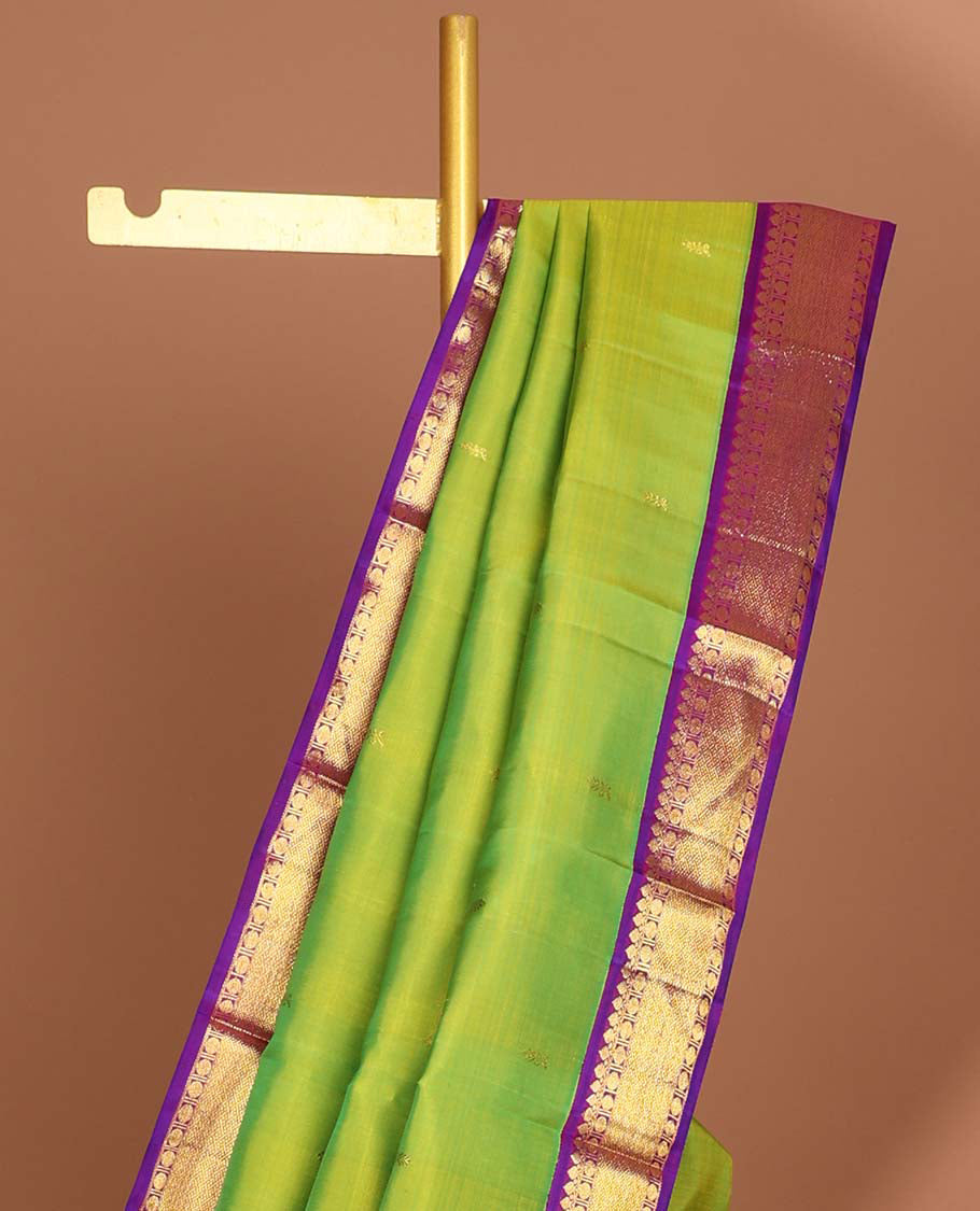 Green leaf buttas kancheepuram silk saree with intricate zari pallu & korvai border of thilakam mokku,paun desigs