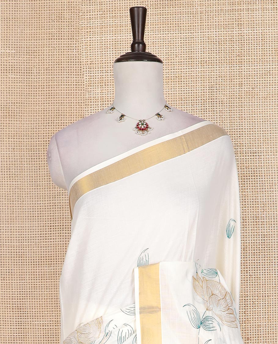 Cream floral, and paisley embroidered Kerala cotton saree, zari border, and floral, and paisley embroidered pallu