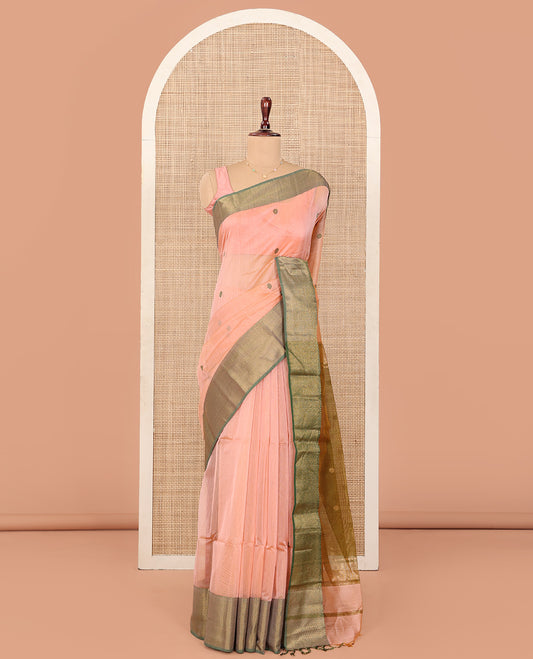Peach Maheshwari Cotton Saree, Masterfully Woven with Thread Buttas All Over Its Body, Complemented by Contrast Traditional Zari Design Border, Pallu Steeped with Flower Buttas, and Paired with a Contrast Blouse