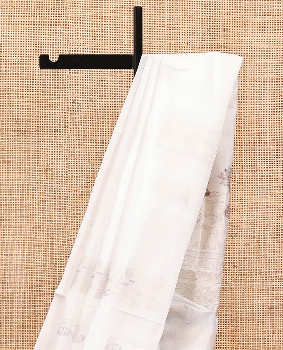 Borderless Cream Mayuri Soft Silk Saree, Sparsely Woven with Pichwai Lotus and Cow Buttas All Over Its Body, Highlighted by Pallu of Pichwai Designs, and Paired with a Matching Blouse