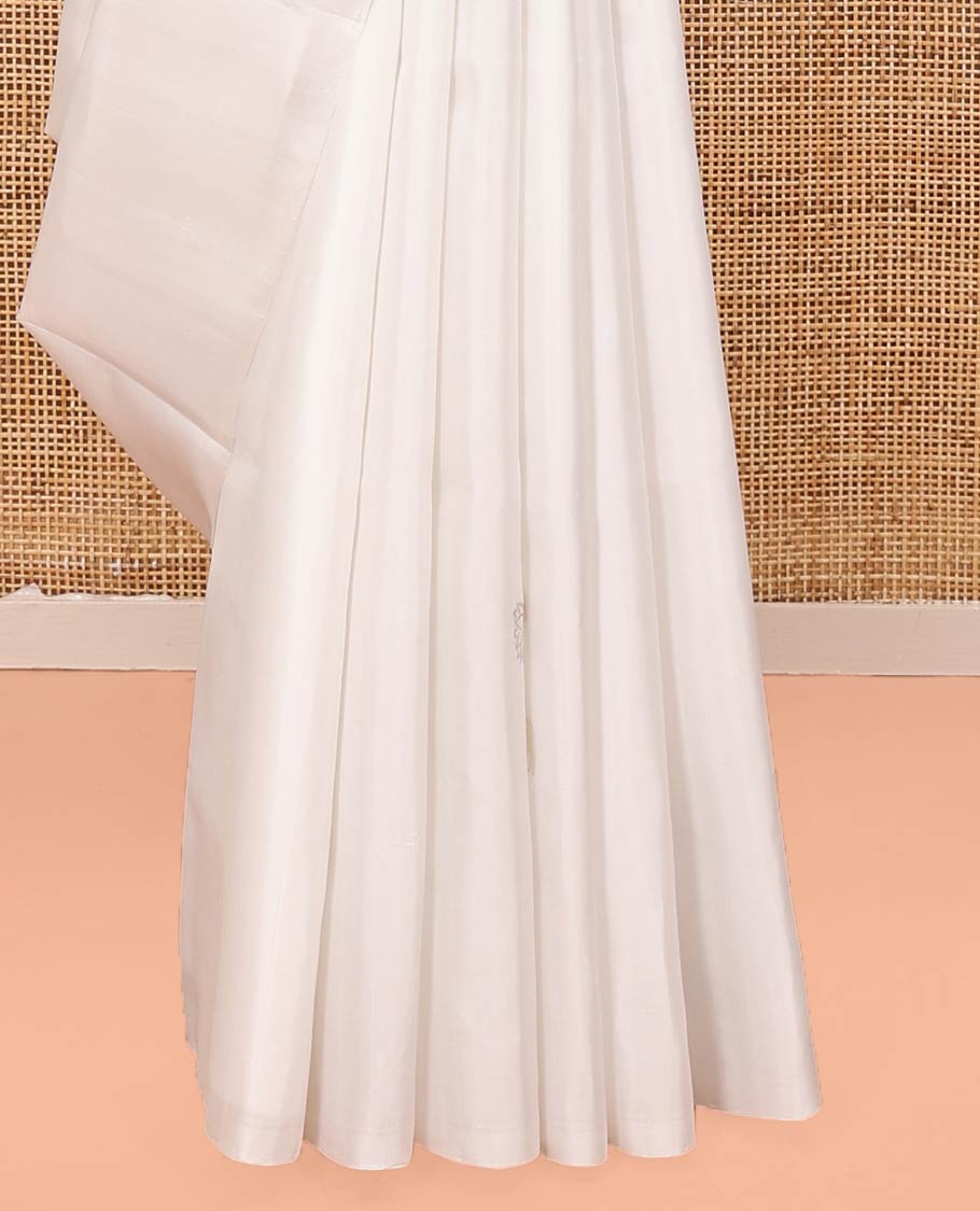 Borderless Cream Mayuri Soft Silk Saree, Sparsely Woven with Pichwai Lotus and Cow Buttas All Over Its Body, Highlighted by Pallu of Pichwai Designs, and Paired with a Matching Blouse