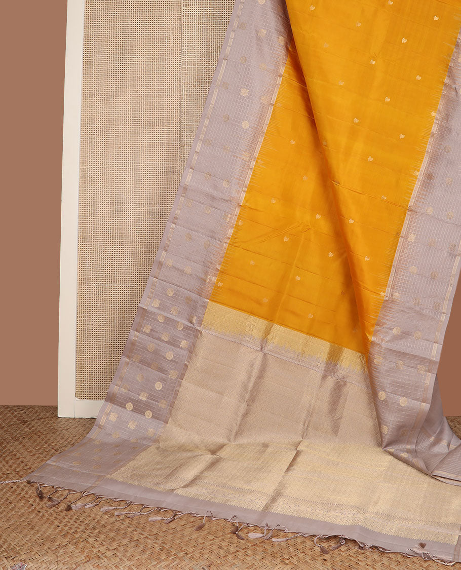 Yellow zari buttas soft silk saree, contrast checked border of annam chakram motifs & zari-rich jaal pallu