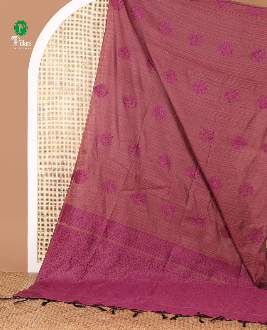 Borderless pink banaras jute silk saree with floral thread buttas woven all over it's body, intricate pallu & butta design blouse