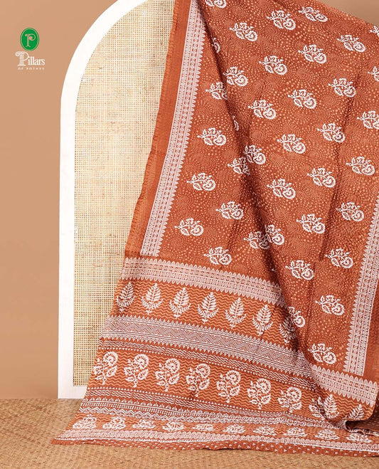 Brown floral printed litchi crushed saree, geometric printed border, floral-geometric printed pallu & triangle motif printed blouse
