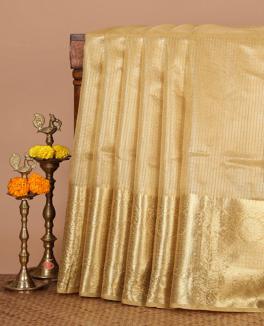 Gold sparsely checks Banaras tissue saree, big zari border of thilakam mokku, leaf motif & floral creeper & zari design blouse