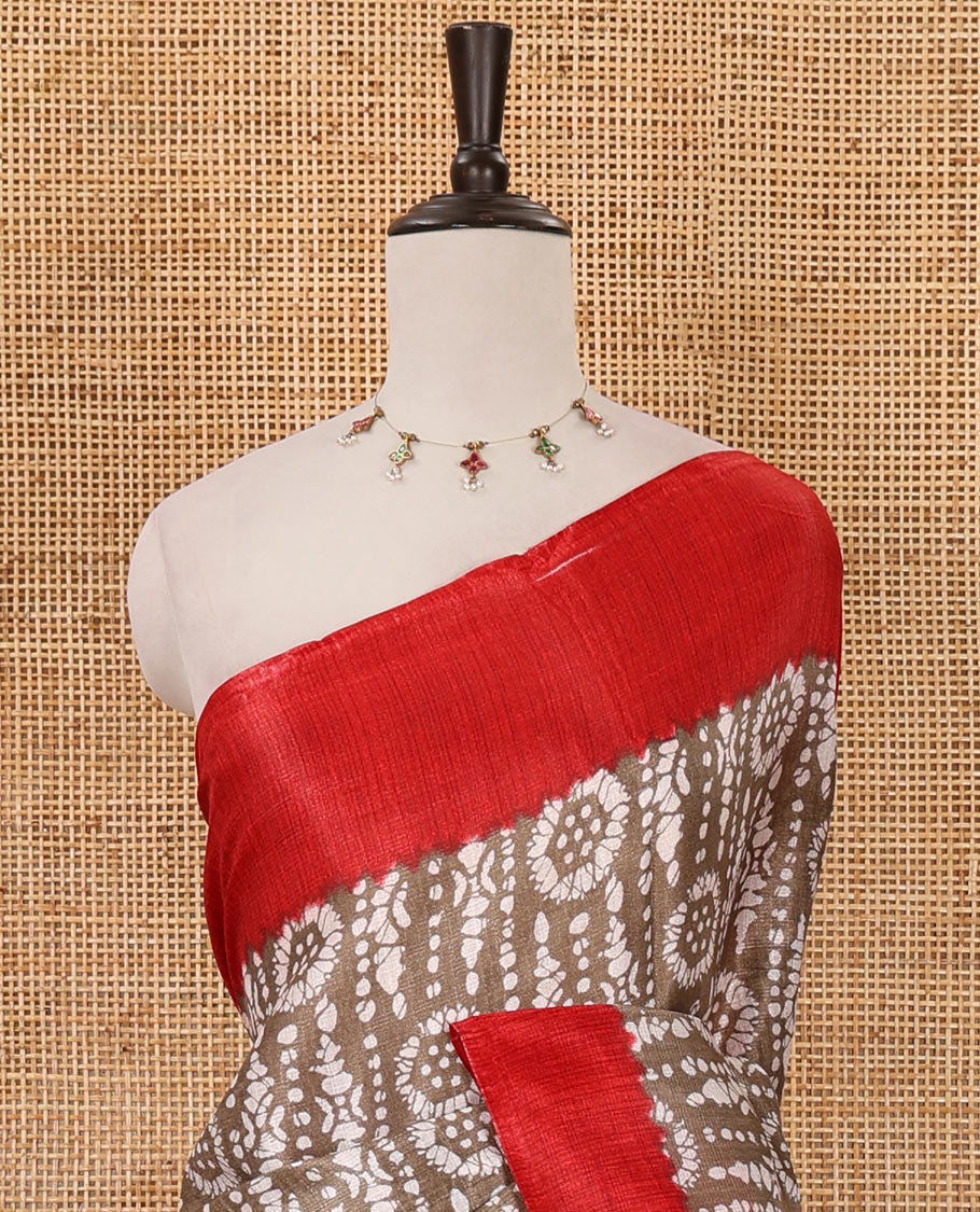 Brown batik-style printed khadi cotton saree, contrast plain border, patola printed pallu & contrast plain blouse