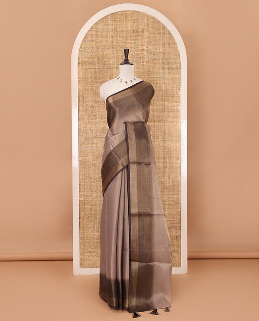 Brown plain tissue saree, contrast gold zari piping border & self pallu with tussels