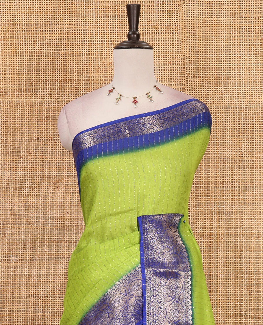 Parrot green gold zari vertical striped dola silk saree, contrast traditional zari border of manga design, striped pallu & contrast diamond design blouse