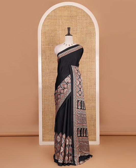 Black plain gajji silk saree with ajrak printed border, ajrak printed geometric pallu, and printed blouse