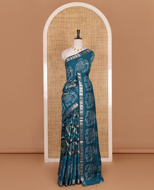 Dark blue-rama blue shibori printed muslin cotton saree, contrast batik elephant print border of zari annam, batik elephant pallu, and contrast polka dots print blouse