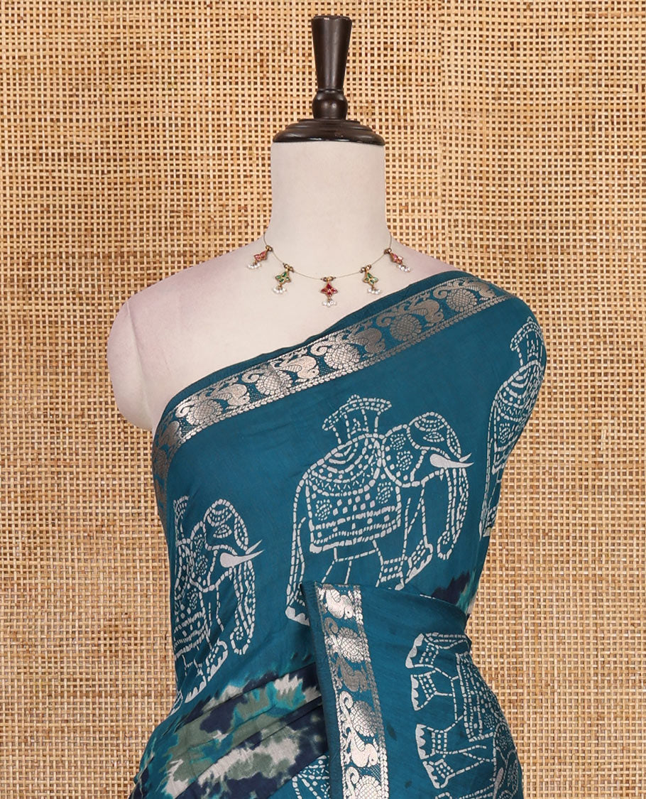 Dark blue-rama blue shibori printed muslin cotton saree, contrast batik elephant print border of zari annam, batik elephant pallu, and contrast polka dots print blouse