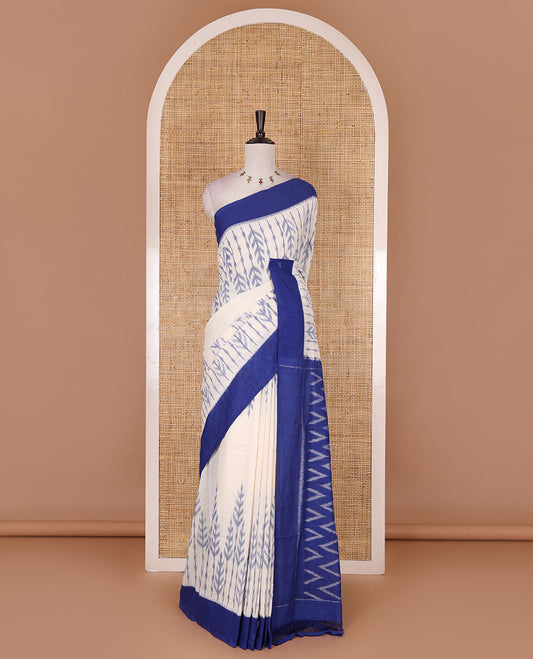 Half white leaf design ikkat cotton saree, contrast plain border,  ikkat chevron pallu, and contrast plain blouse