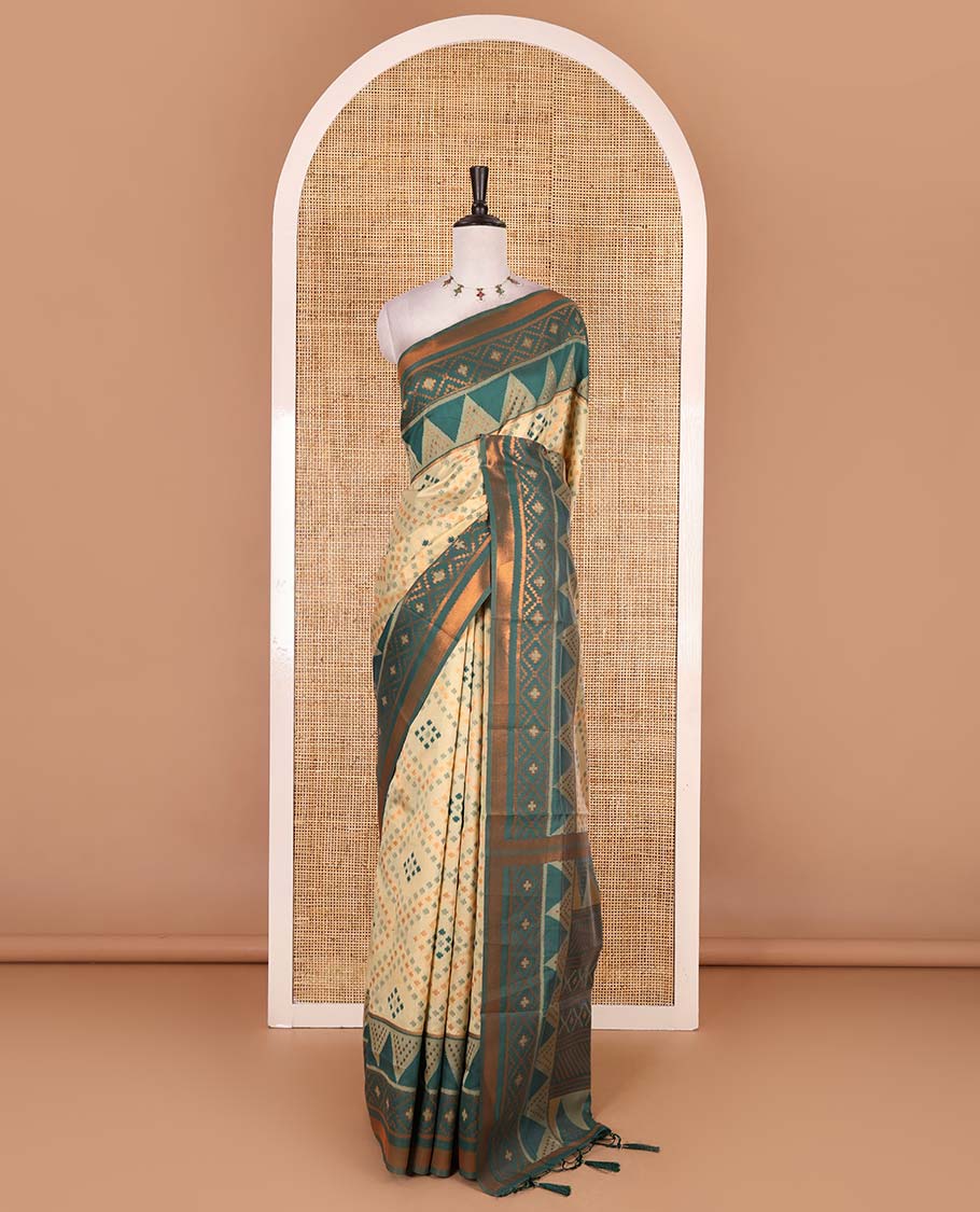 Chikku ikkat style zari and thread buttas semi-tussar saree, contrast ikkat design border, geometric patterned pallu, and a contrast blouse