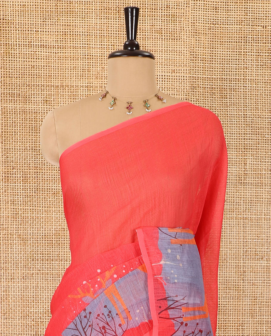 Borderless tomato pink Christmas-theme Snow-fall, moon, Christmas trees, and deer motifs printed linen cotton saree with a contrast printed blouse