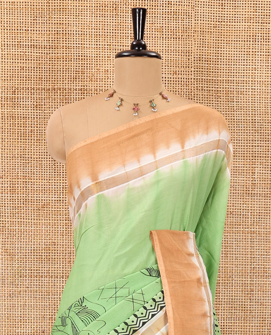Green South Indian women motifs printed chennur silk saree, contrast plain border, printed pallu, and a contrast plain blouse