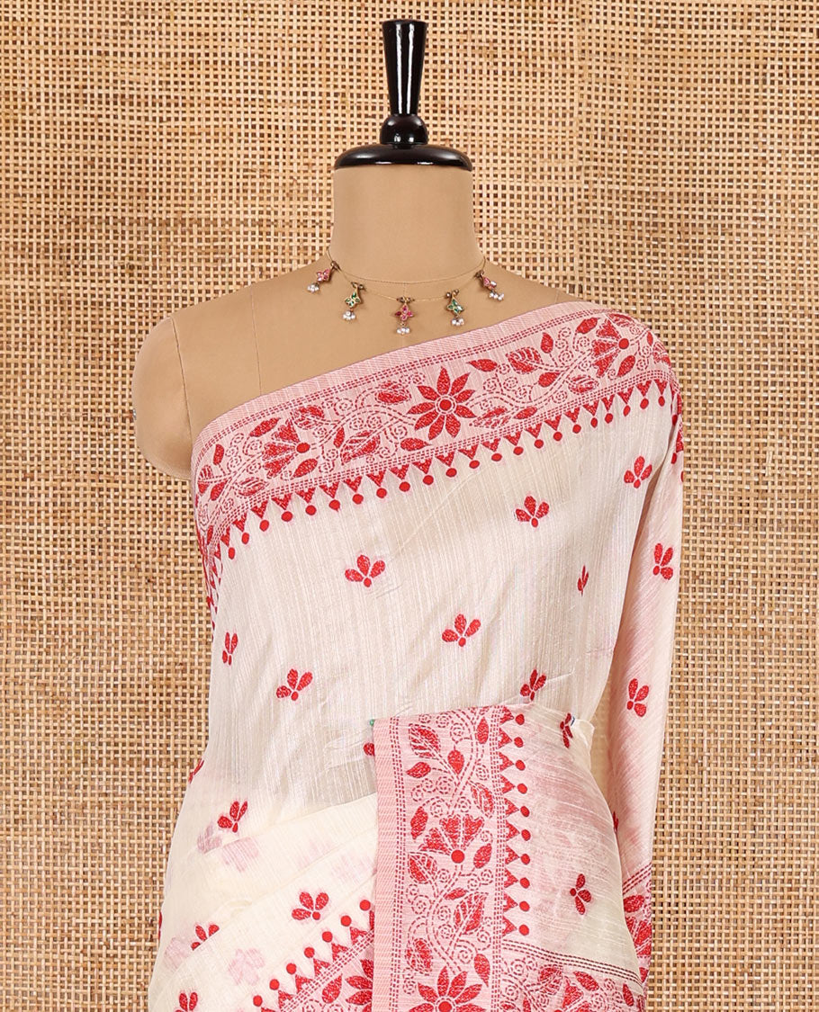 Half-white and red floral thread buttas woven jute cotton saree, floral thread weave border, floral-paisley weave pallu, and a matching blouse