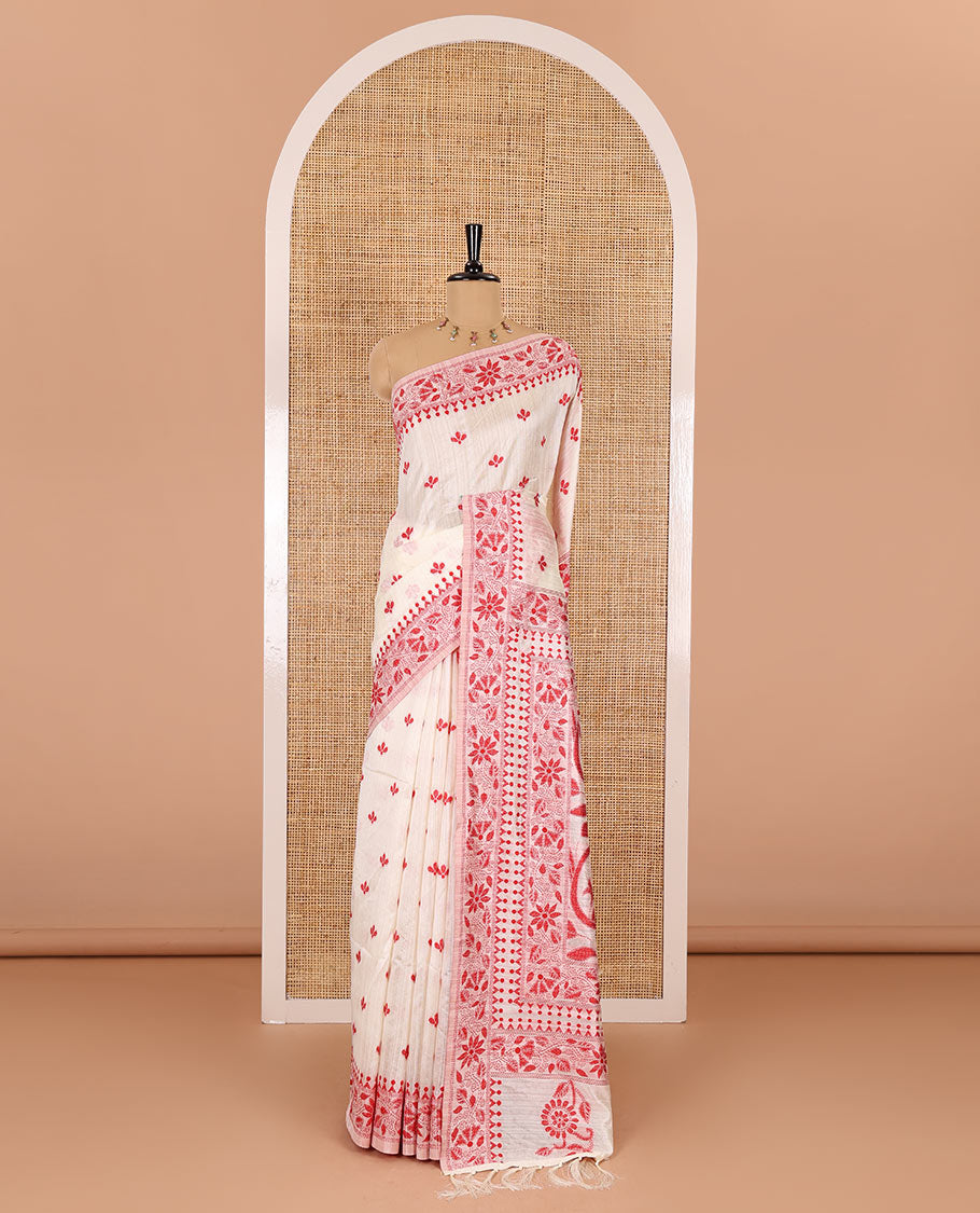 Half-white and red floral thread buttas woven jute cotton saree, floral thread weave border, floral-paisley weave pallu, and a matching blouse