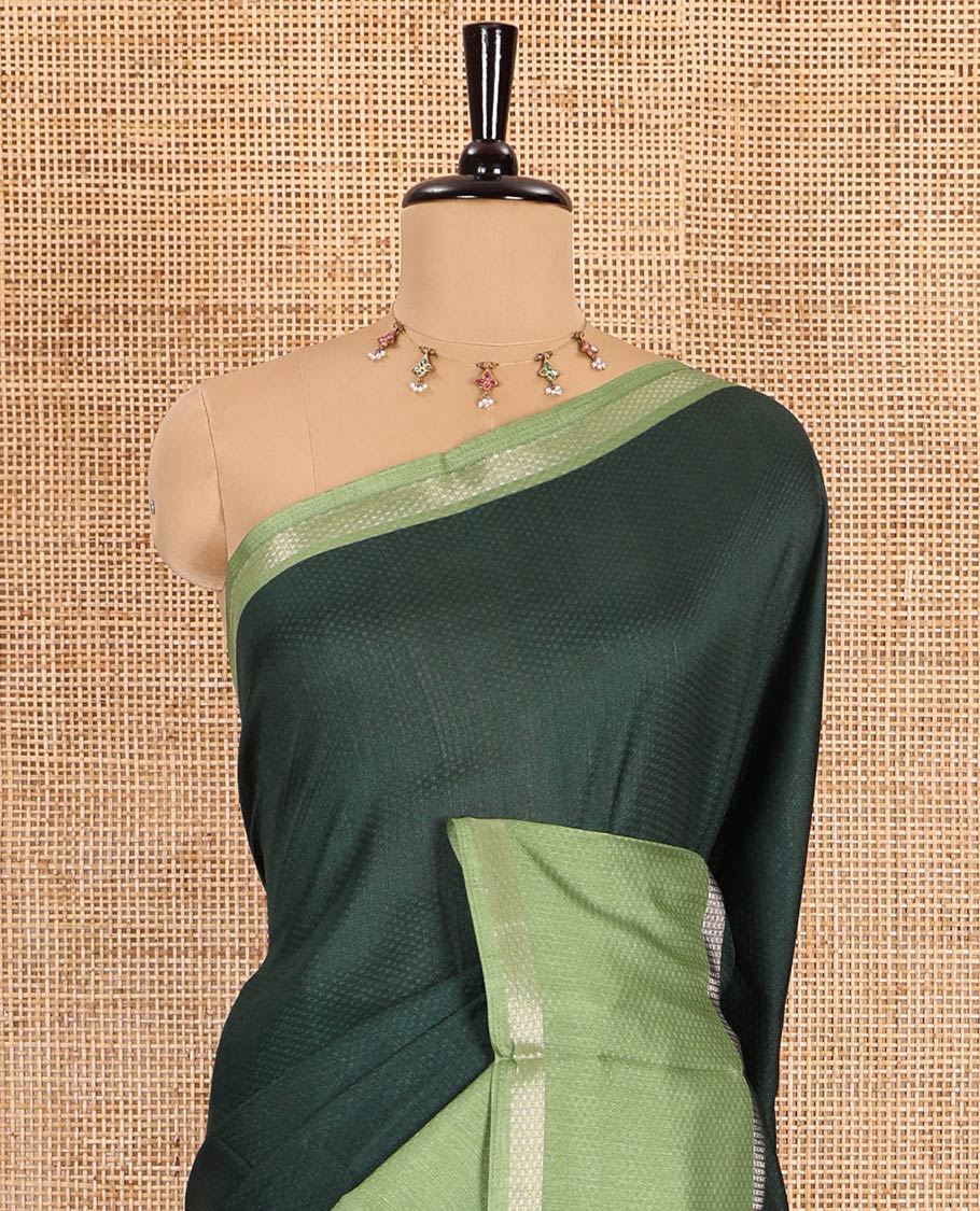 Green embossed moss chiffon saree, contrast traditional rettai pettu border, embossed pallu, and a contrast embossed blouse