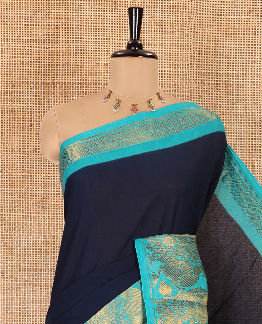 Navy blue plain sungudi cotton saree, contrast peacock motifs zari border, zari striped pallu, and a zari design blouse