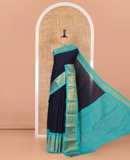 Navy blue plain sungudi cotton saree, contrast peacock motifs zari border, zari striped pallu, and a zari design blouse