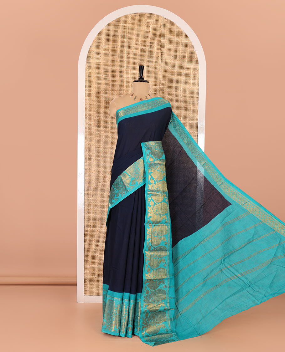 Navy blue plain sungudi cotton saree, contrast peacock motifs zari border, zari striped pallu, and a zari design blouse