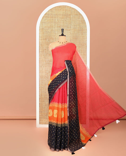 Rani pink batik and bandhani motifs printed linen cotton saree, zari piping border, and a contrast bandhani printed blouse