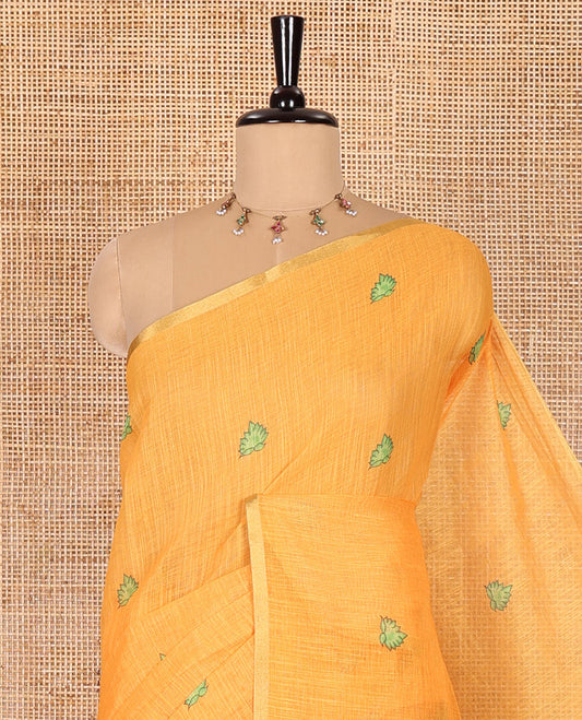 Yellow lotus motifs printed linen saree, piping border, contrast floral vine printed pallu, and contrast printed blouse