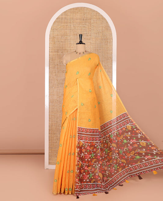 Yellow lotus motifs printed linen saree, piping border, contrast floral vine printed pallu, and contrast printed blouse