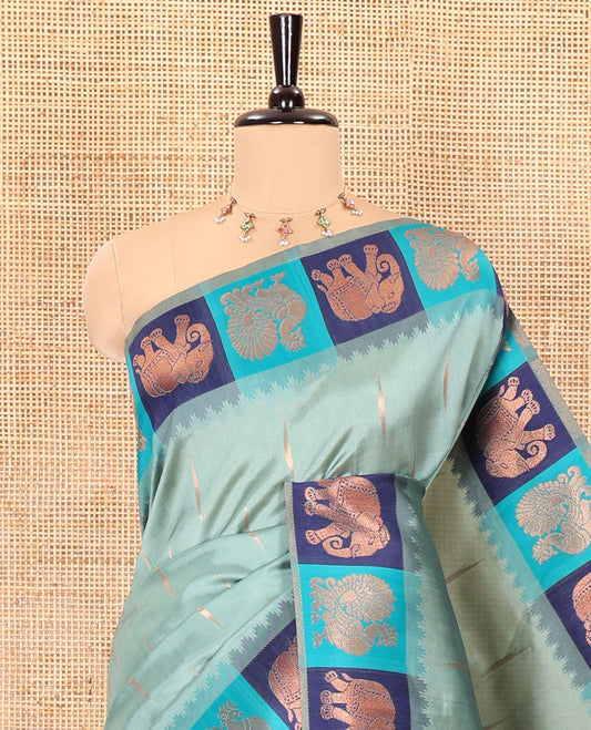 Blue copper zari buttas woven kanchi silk saree, contrast temple border of peacock and elephant motifs, zari-rich pallu, and a zari design blouse