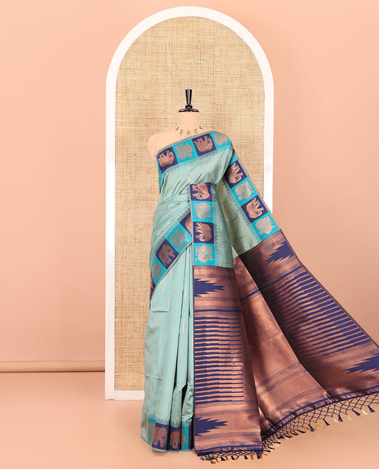 Blue copper zari buttas woven kanchi silk saree, contrast temple border of peacock and elephant motifs, zari-rich pallu, and a zari design blouse