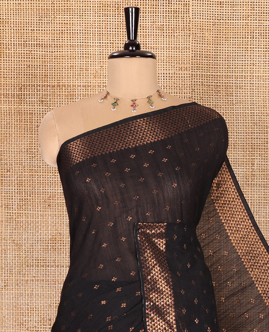 Black Khadi Mul Cotton Saree Beautified with Plus-Shaped Zari Buttas Across Its Body, Featuring a Subtle Zari Border Adorned with Triangle Motifs, a Tissue Pallu, and Complemented by a Running Blouse