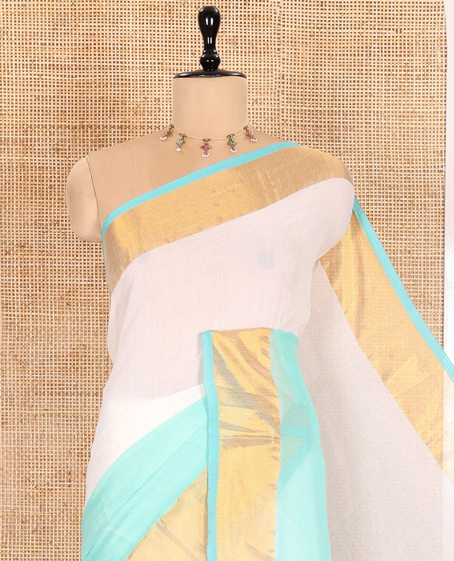 Cream and Sea Green Plain Khadi Mul Cotton Saree Features a Gleaming Zari Bavanji Border and a Contrast Sea Green Plain Blouse