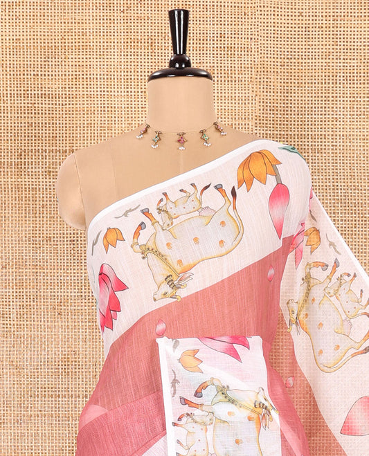 Dusky Pink Linen Cotton Saree Decked Up with Lotus Buds Buttas, Complemented by a Contrast Border of Pichwai Cow and Lotus Motif Prints, a Pallu Mirroring the Same Print, and Paired with a Lotus-Printed Blouse