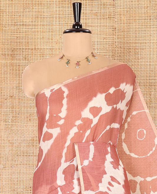 Borderless Brown Linen Cotton Saree Delicately Printed with Shibori Patterns, Complemented by Contrast Pallu Steeped with Floral Vine Print, and Paired with a Contrast Floral Printed Blouse