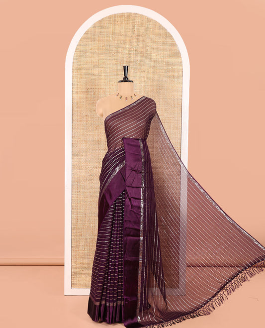 Violet Viscose Georgette Saree Gleamed with Horizontal Golden Zari Stripes All Over Its Body, Accentuated by a Satin Plain Border, a Self Pallu Featuring the Same Horizontal Stripes, and Paired with a Running Blouse
